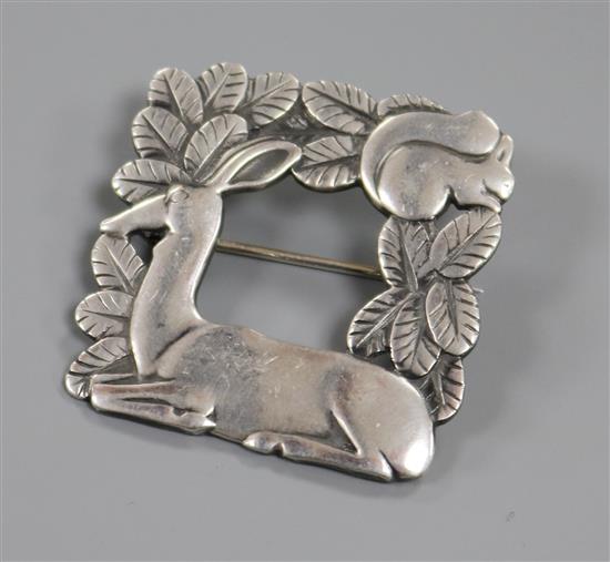 A Georg Jensen sterling silver recumbent deer brooch, no. 318, 38mm.